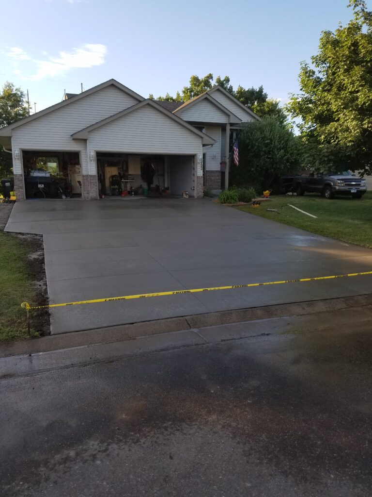 Finished concrete driveway project by Becker Concrete